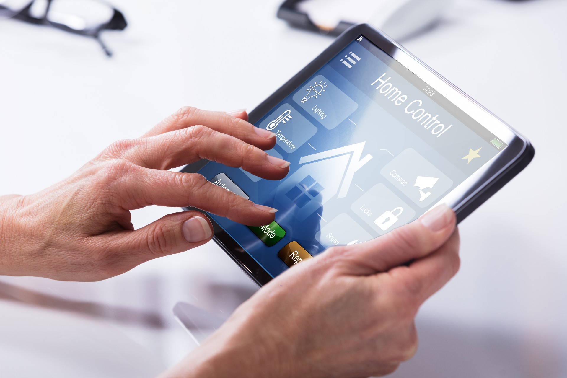 senior holding tablet for home control smart tech